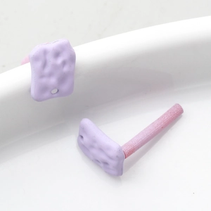 Macro detail of purple textured rectangular jewelry components for DIY earring making