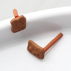 Detail view of creative biscuit-shaped alloy stud earrings for DIY jewelry making