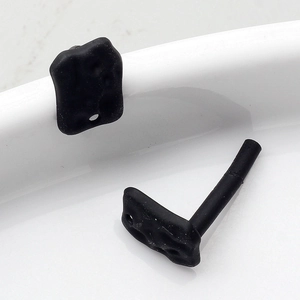 Detailed macro view of black geometric matte alloy DIY jewelry earring accessories