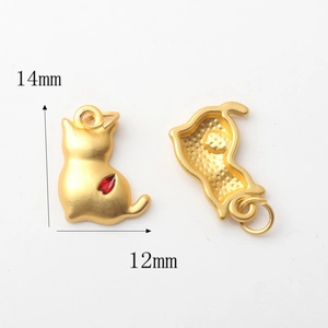 Detailed front and back view of gold cat pendant with red enamel, size 14mm by 12mm