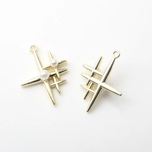 Macro view of 925 silver cross star charms with pearls and hallmark for DIY jewelry