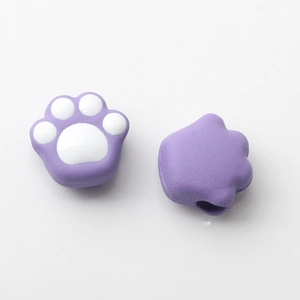 Close-up of cute purple and white cat paw beads for DIY jewelry and accessories