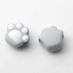 Detailed view of cute cat paw alloy beads with grey enamel for DIY jewelry making