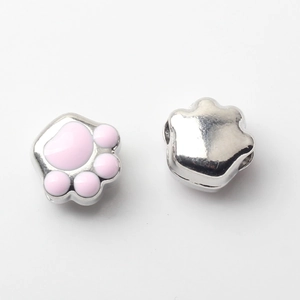 Detailed view of pink enamel cat paw beads for DIY jewelry making and necklaces
