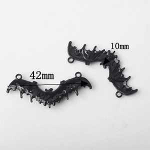 Detail of 42mm black enamel bat charms for DIY jewelry making with wing texture
