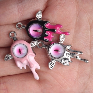 Three creative alloy evil eye wing pendants in black, pink, and silver for DIY jewelry