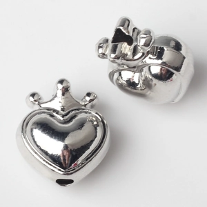 Detail of silver alloy crown heart charms with polished finish for DIY jewelry
