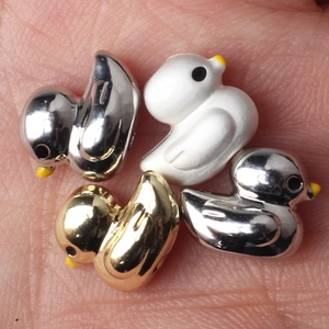 DIY duck beads for jewelry making in polished gold, silver, and matte white finishes