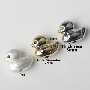 Bird-shaped charms in white, gold, and silver finishes for DIY jewelry making