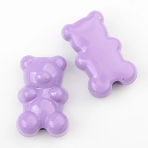 Close-up of two purple gummy bear alloy beads with a glossy finish for DIY jewelry