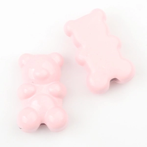 Close-up of pink gummy bear charms with a glossy finish for DIY jewelry making