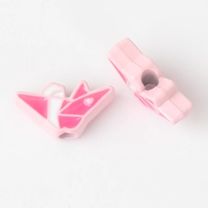 Detail of pink and white enamel paper crane beads with side holes for DIY jewelry