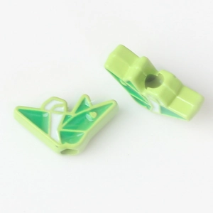 Detail of green and white enamel paper crane alloy beads for DIY jewelry making