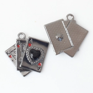 Detail of alloy poker card pendants with black heart stone and top hanging rings