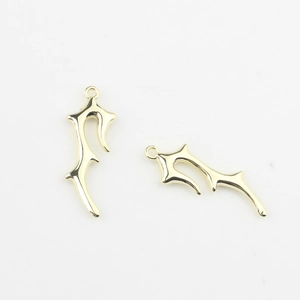 Detailed view of two gold alloy irregular branch pendants for DIY jewelry making