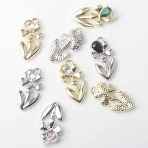 Close-up of alloy tulip flower charms with crystals for DIY jewelry making