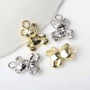 Macro shot of bear charms in gold and silver plating for DIY jewelry making accessories