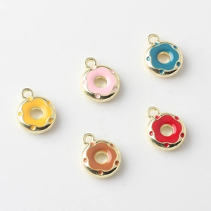 Detailed view of colorful alloy donut charms with enamel finish and gold hanging loops