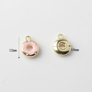 Detailed view of 10mm pink donut charm showing front enamel and smooth golden back side