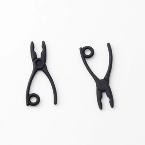 Macro view of matte black pliers charms for creative DIY jewelry making and earrings