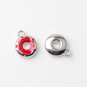 Detailed front and back view of red enamel donut charms for DIY jewelry making