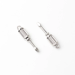 Detail view of silver alloy screwdriver pendant with textured handle for DIY jewelry making