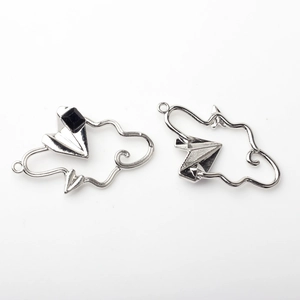 Detail of silver cloud and paper plane charms with black crystal for jewelry making