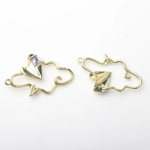 Detailed view of hollow cloud charms with paper airplane and purple crystal in gold plating