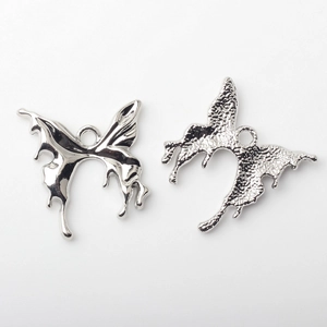 Front and back detail of liquid metal butterfly pendant with smooth and matte texture