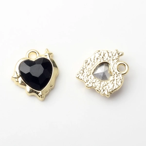 Detailed front and back view of gold heart charm with black gemstone for DIY jewelry crafts