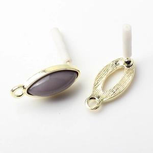 Detail of vintage golden alloy oval jewelry connectors for DIY handmade earring making