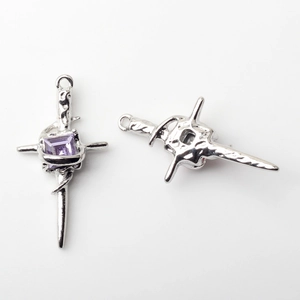 Detailed front and back view of alloy cross pendant with purple gemstone and thorn details