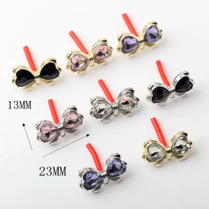Minimalist alloy bow earring charms with heart-shaped crystals and gold metal frames