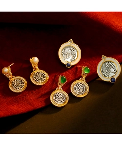 Macro shot of vintage coin jewelry set with pearls and emeralds on red velvet