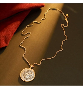 Detailed close-up of a vintage coin pendant with relief on a golden rope chain