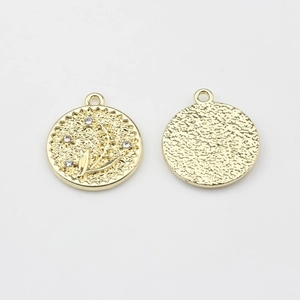 Detailed view of alloy flower charms with rhinestones and hammered texture back