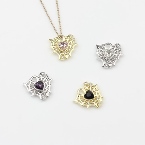Alloy mesh hollow heart pendant with zircon accents in gold and silver plating