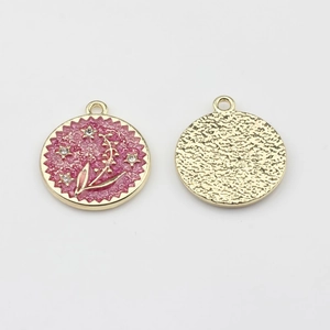 Detail of round flower enamel charm with pink oil finish and sparkling crystals for DIY jewelry