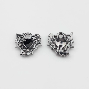 Detailed front and back view of heart-shaped spider web charm with black zircon