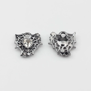 Detail of gunmetal alloy heart spiderweb charms with clear zircon for DIY jewelry making