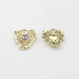 Detail of gold hollow mesh heart pendant with pink zircon and clear crystals