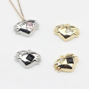 Minimalist heart-shaped jewelry pendants with sparkling gems and star details in gold and silver