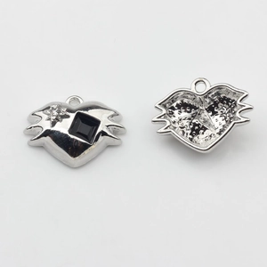 Macro view showing both sides of a heart charm with black and star stones