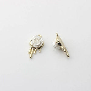 Detailed view of 3D pearl rose charms with melting drop design and gold alloy base