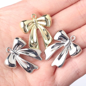 Ciondoli a fiocco lucidi in oro e argento per accessori per la creazione di gioielli