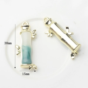 Bamboo style alloy pendant with faux jade gradient inlay and gold leaf details
