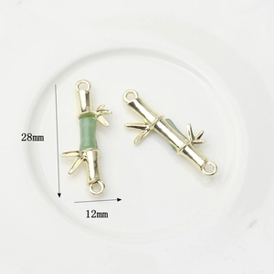 Bamboo-style gold pendant with green imitation jade and 28mm by 12mm size markers