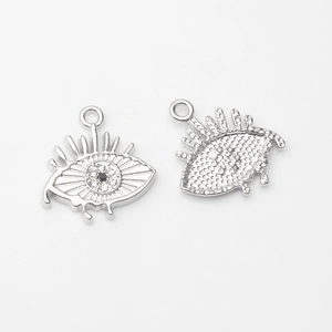 Detailed front and back view of silver Evil Eye charms with white zircon inlay