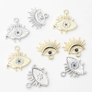 Detailed view of alloy Evil Eye charms with zircon inlay for DIY jewelry making