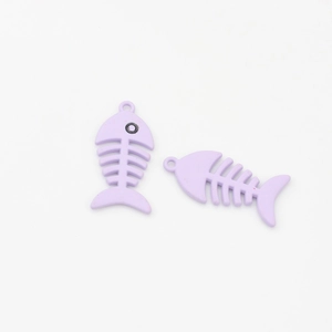 Close-up of a matte purple fishbone alloy pendant for DIY jewelry and earring making